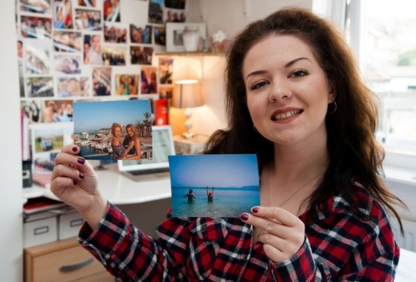 PIC BY KEITH WHITMORE/ CATERS NEWS - (PICTURED: Laura Rose holding pictures of her and her friends on holiday she funded using money she made on Ebay) - This is the savvy student who splashes the cash on jetset holidays - after making a whopping 30,0000 selling her old clothes on ebay. While her friends scrimp and save their way through university, Laura Rose splashes out on THREE holidays a year thanks to her eBay earnings. The pretty third-year student, who is studying business management at the University of East Anglia, started flogging her old clothes when she was still in sixth form. But she soon became hooked and found she could make a hefty profit getting rid of her unwanted garments. SEE CATERS COPY.