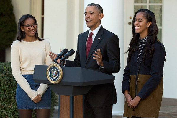 WASHINGTON, DC - NOVEMBER 25: U.S. President Barack Obama delivers remarks with his daughters Sasha (L) and Malia during the annual turkey pardoning ceremony in the Rose Garden at the White House November 25, 2015 in Washington, DC. In a tradition dating back to 1947, the president pardons a turkey, sparing the tom -- and his alternate -- from becoming a Thanksgiving Day feast. This year, Americans were asked to choose which of two turkeys would be pardoned and to cast their votes on Twitter. (Photo by Chip Somodevilla/Getty Images)