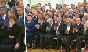 Как чиновники слушали речь Владимира Путина. На скриншотах зрителей — мрачные и растерянные лица